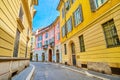 Narrow Via Santa Marta street leads between historic mansions, Milan, Italy