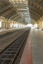 Narrow view of a locomotive electric train station platform with covered tunnel, Chennai, India, Mar 29 2017