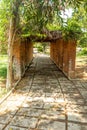 Narrow view of red brick pillar pathway in a garden, Chennai, India, April 1st 2017