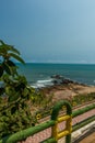 Narrow view of seashore with wooden fence in the foreground from viewpoint,Kailashgiri,Visakhapatnam,AndhraPradesh,March 05 2017 Royalty Free Stock Photo