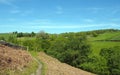 Narrow path on high moorland surrounded by pasture with stone walls above crimsworth dean valley in west yorkshire Royalty Free Stock Photo