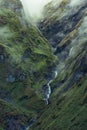 Narrow waterfall sliding down the rocks in Himalayas, Nepal