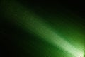 Narrow white beam of light on a bright green background to the point Royalty Free Stock Photo