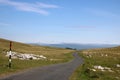 Narrow winding country road over moorland, Cumbria