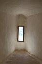 Narrow window in medieval corridor Royalty Free Stock Photo