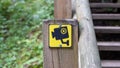 Narrow wooden path winding through forest. Picture of stairs on a hill leading to the top. Nature trail. The indication Royalty Free Stock Photo