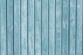 Narrow wooden planks. Gray and light blue wood vertical boards. Weathered colored old fence. Rough texture. Striped wooden backgro Royalty Free Stock Photo