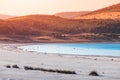 Zoom view of the white sandy beach with grass bushes on the famous lake Salda in Turkey. Wonders of nature and turkish