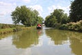 Narrowboat cruising an English canal