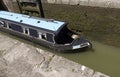 Narrowboat passing through a lock Royalty Free Stock Photo