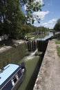 Narrowboat passing through a lock at Devizes UK Royalty Free Stock Photo