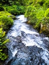 The narrowness of the river channel increases the speed of the river flow Royalty Free Stock Photo