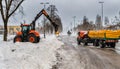 Narva Estonia 10 March 2022 . The tractor cleans road from snow. Spring cleaning of the city