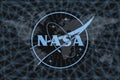 NASA logo, on a black background with a world map and a network. The concept of space exploration