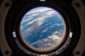 NASA provided the space station window view of the planet earth used in this image