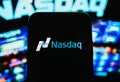 Nasdaq logo on mobile phone screen. Royalty Free Stock Photo