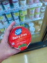 NASHUA, NH / USA - JUNE 06, 2020: Silk, Non-Dairy, Soy-based Yogurt at Shaws Market, Held in Customer's Hand, June 06, 2020