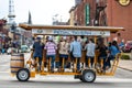 Nashville, Tennessee - March 25, 2019 : A Pedal Tavern party bike on a  sunny day crossing Broadway. Royalty Free Stock Photo