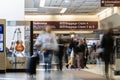 Nashville, Tennessee - March 22, 2019 : People in motion in the baggage claim area at Nashville International Airport