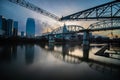 Nashville, Tennessee - March 23, 2019 : The Nashville skyline and John Seigenthaler Pedestrian Bridge reflecting in the Cumberland Royalty Free Stock Photo