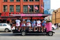 Nashville, Tennessee, U.S - June 26, 2022 - Passengers on the pink color of Music City Crawler moving along the bars and