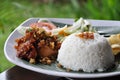 Nasi ayam kremes with vegetables