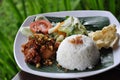 Nasi ayam kremes with vegetables