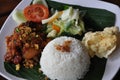 Nasi ayam kremes with vegetables