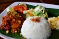 Nasi ayam kremes with vegetables