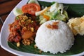 Nasi ayam kremes with vegetables