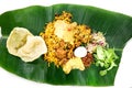 Nasi briyani with lamb mutton served on banana leaf plate