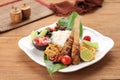 Nasi Campur Bali, Indonesian Balinese Rice with Sate Lilit, Ayam Sisit, Sambal Matah, and Peanut