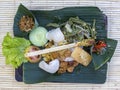 Nasi Campur Bali . Balinese dish of steamed rice with variety of side dishes. Close up. Asian food, Ubud, Bali, Indonesia. Royalty Free Stock Photo