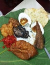 Nasi Jamblang, Indonesian traditional cuisine, rice with side dishes , on the top of teak leaves