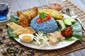 Nasi kerabu, blue color rice salad, malaysian cuisine