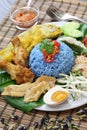 Nasi kerabu, blue color rice salad, malaysian cuisine