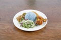 Nasi kerabu or nasi ulam, popular Malay rice dish. Blue color of rice resulting from the petals of butterfly-pea flowers.