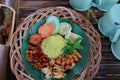 Nasi Kuning. Javanese turmeric rice with assorted side dishes Royalty Free Stock Photo