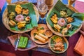 Nasi lemak, Nasi campur, Indonesian Balinese rice with potato fritter, sate lilit, fried tofu, spicy boiled eggs, and