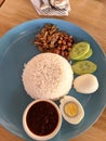 nasi lemak or glutinious rice on a blue plate
