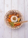 Nasi lemak / Nasi campur, Indonesian Balinese rice with potato fritter, sate lilit, fried tofu, spicy boiled eggs, and peanut