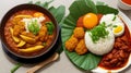 nasi lemak, a traditional malay curry paste rice dish served on a banana leaf Royalty Free Stock Photo