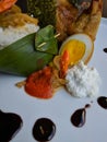 Nasi Liwet is Indonesian traditional food, Sego Liwet is savory rice cooked with coconut like uduk rice, served with pumpki Royalty Free Stock Photo