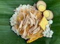 Nasi Liwet Solo, a traditional food from Surakarta, Indonesia, savory steamed rice with pulled chicken curry and chicked egg Royalty Free Stock Photo