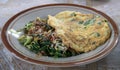 Nasi Pecel, Javanese traditional menu with spicy peanut sauce, boiled vegetables, and fried egg for breakfast or lunch