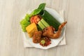 Nasi Timbel Komplit, Traditional Sundanese Rice Wrapped with Banana Leaf Royalty Free Stock Photo