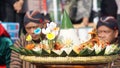 Nasi tumpeng (cone rice) served with urap-urap (Indonesian salad), fried chicken and noodles