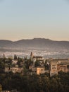 The Nasrid palaces part of the castle Alhambra in Granada, Andalusia, Spain, during sunset, from the Mirador de la Cruz de Rauda Royalty Free Stock Photo