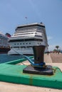 Nassau, Bahamas - May 14, 2019: Carnival Sunrise cruise ship docked at Prince George Wharf. Mooring pole and mooring rope in the