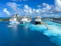 An aerial view of the cruise ship harbor in Nassau, Bahamas from a cruise ship that is sailing away